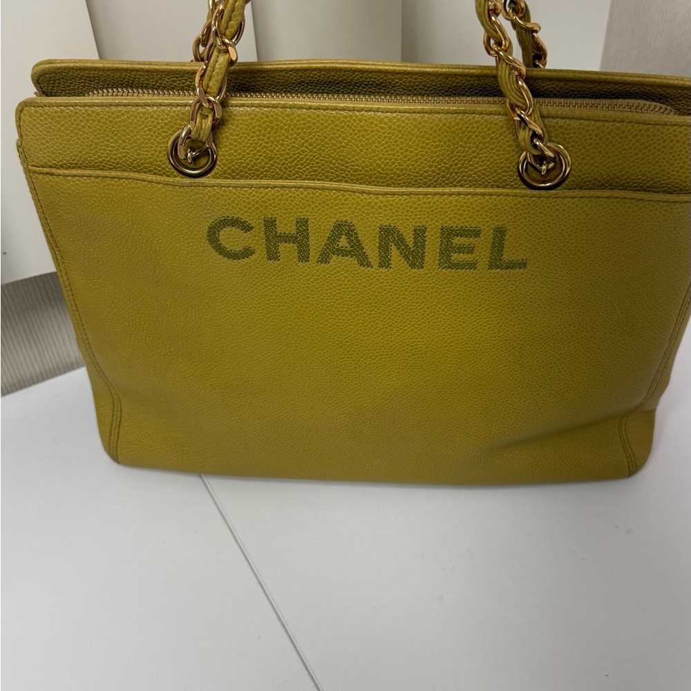 Rare Authentic 1990’s Vintage Chanel chain tote, Bold embossed logo. 
Timeless.